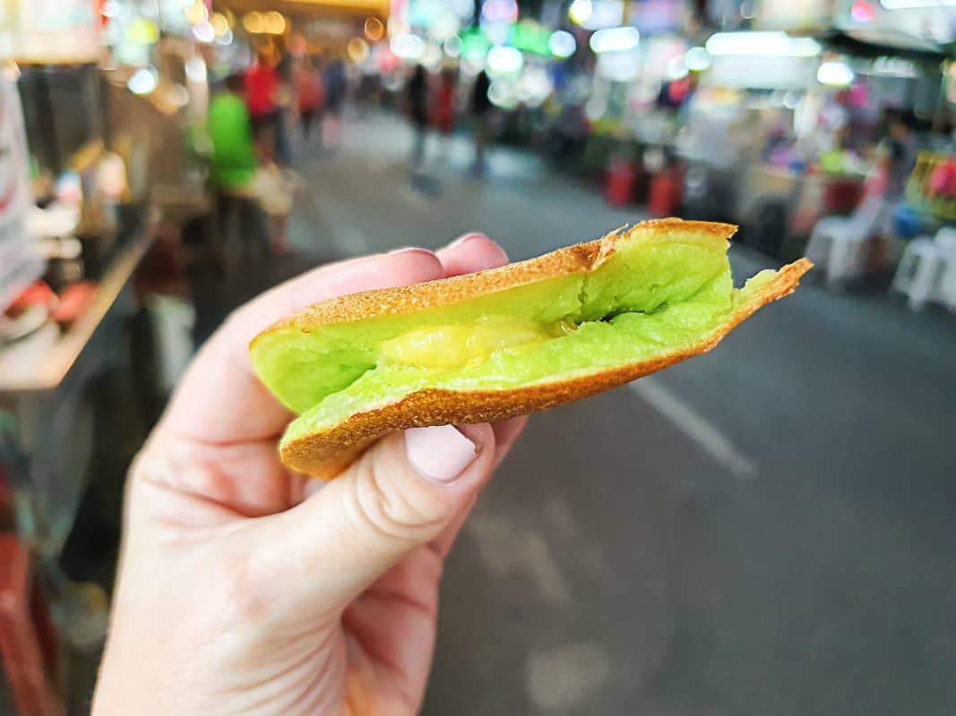 Eating apom manis on the street in Penang, Malaysia. 