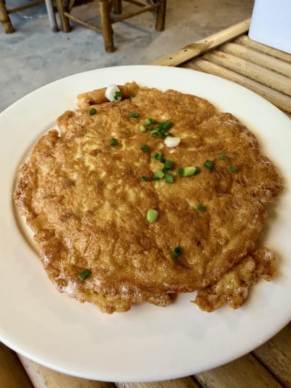 Thai Omelet with Pork
Fluffy, crispy-edged fried egg omelet served over steamed rice